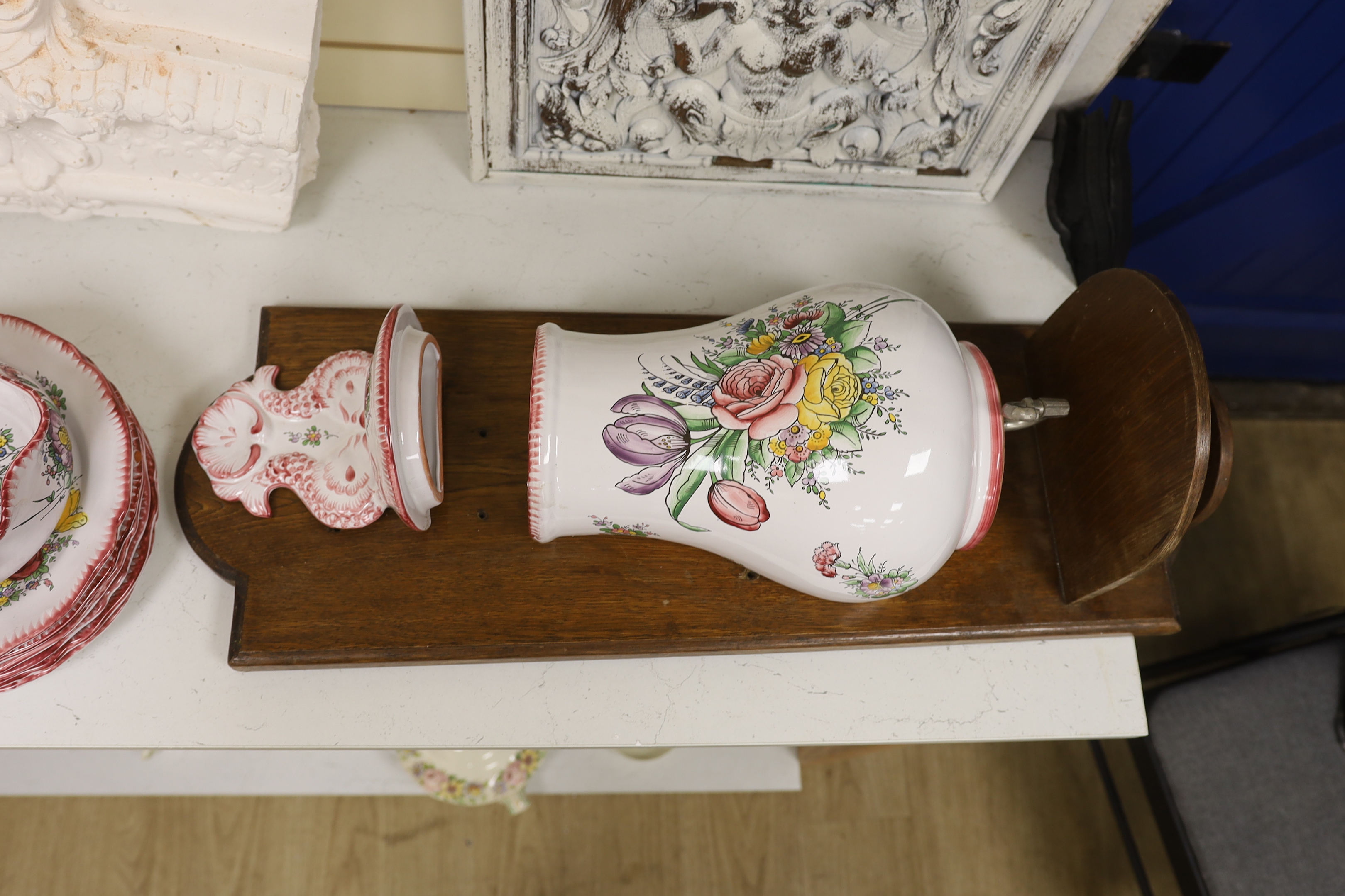 Le Renoleau Faiencerie D'Art, Angouleme, French faience tableware with floral decoration, including lidded serving pots, tureens, jugs, serving dishes, coasters, plates, candle stands, a candlestick, a water dispenser fo